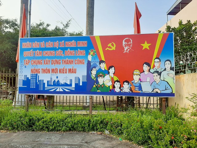 Khẩu hiệu thực hiện Chương trình mục tiêu quốc gia xây dựng nông thôn mới của xã Nghĩa Minh.