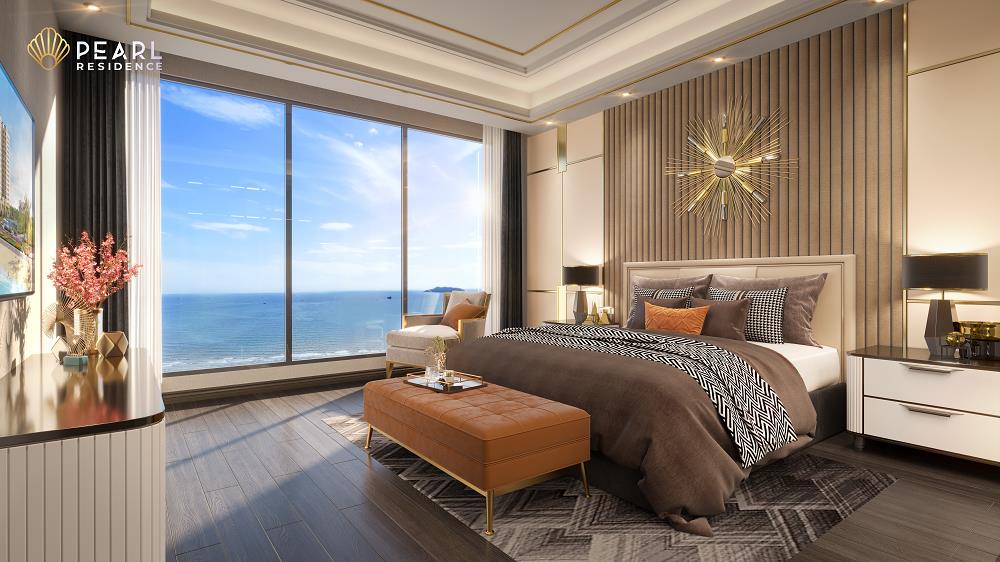 A bedroom with a large window overlooking the ocean

Description automatically generated