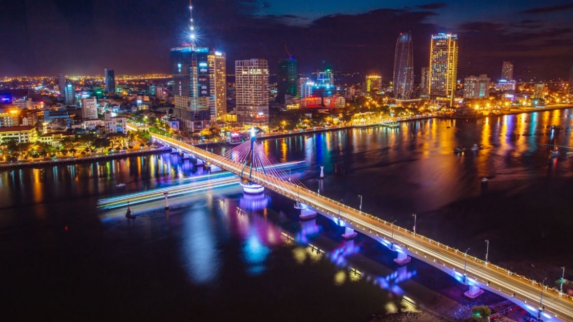 A bridge over a body of water with lights at night

AI-generated content may be incorrect.
