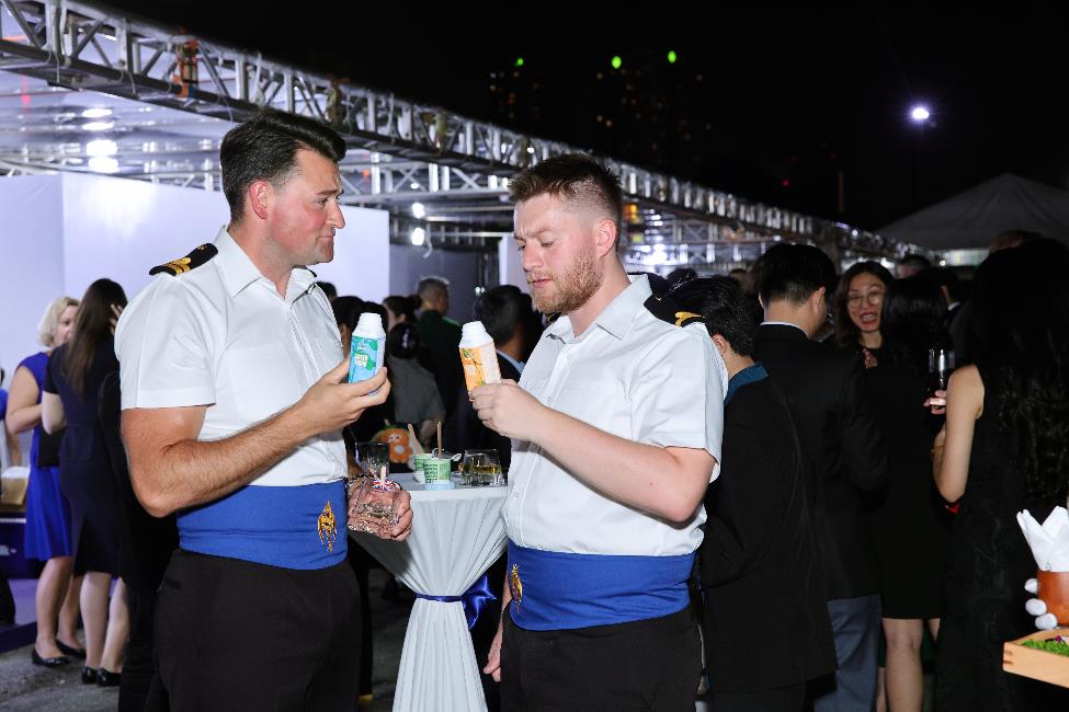 Two men in uniform holding drinks

AI-generated content may be incorrect.