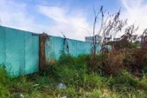 Xác định danh tính xác người chết khô dưới lớp cỏ trong bãi đất trống