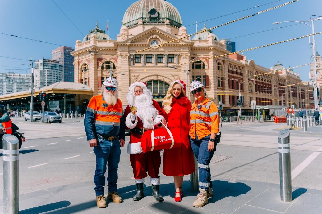 A group of people in clothing posing for a photoDescription automatically generated