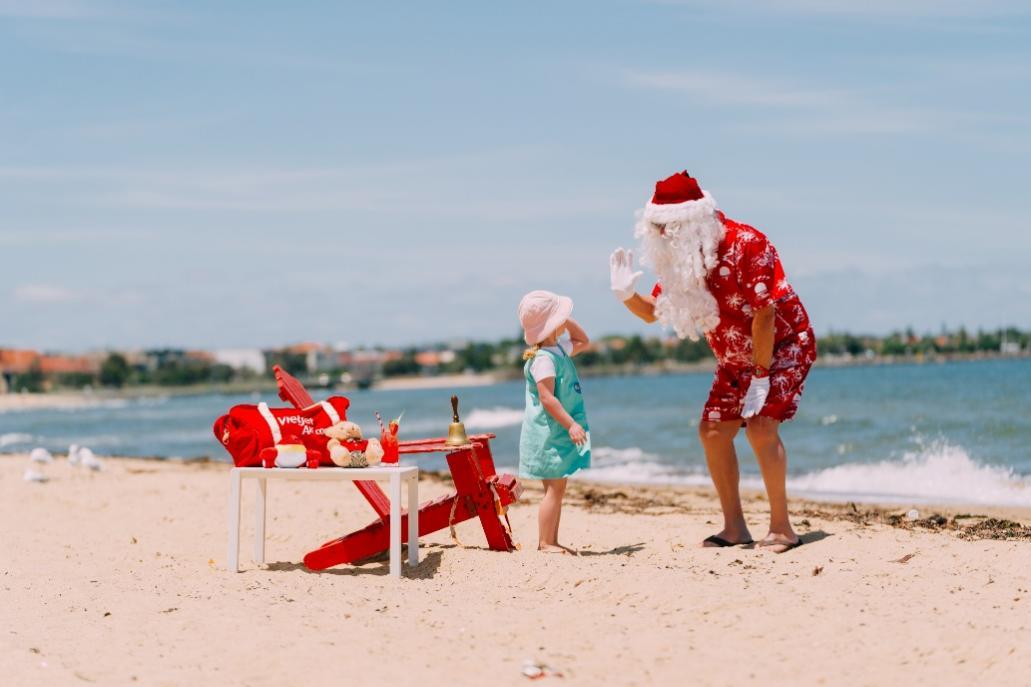 A person and child on a beachDescription automatically generated