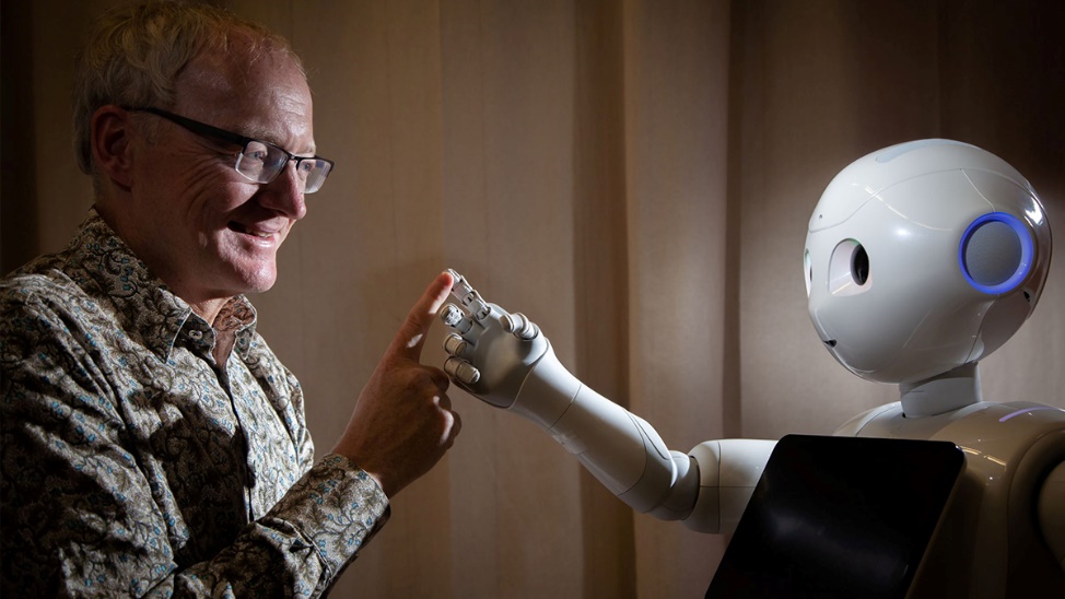 A person touching a robot's hand

AI-generated content may be incorrect.