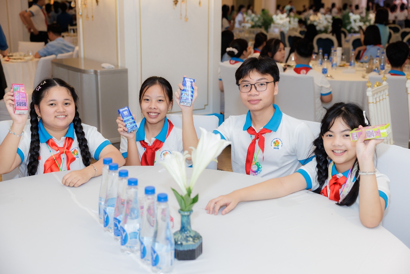A group of people sitting at a tableAI-generated content may be incorrect.
